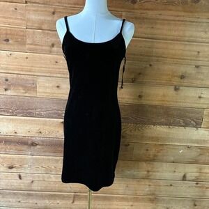 Y2K Black velvet bodycon mini dress with adjustable straps and tie detail.